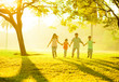 Photo: Asian family holding hands running Asian family holding hands running