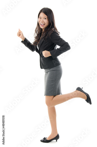 Photo: Business woman running. Business woman running.