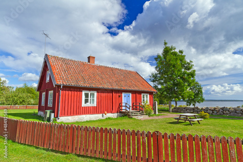 Photo: Traditional red Swedish cottage house Traditional red Swedish cottage house