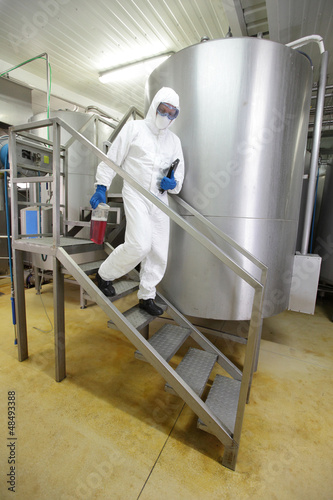 Photo: professional walking down the stairs in lab plant professional walking down the stairs in lab plant