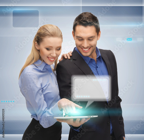 Photo: man and woman with tablet pc man and woman with tablet pc