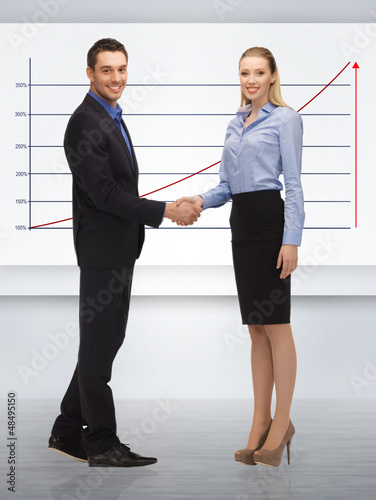 Photo: man and woman shaking their hands man and woman shaking their hands