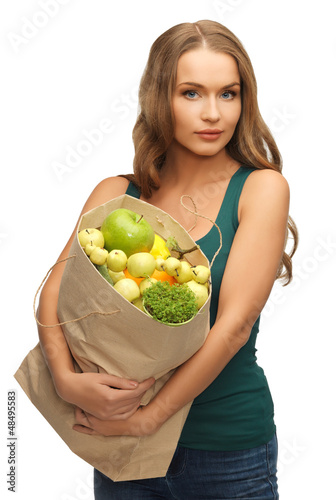 Photo: woman with shopping bag full of fruits woman with shopping bag full of fruits