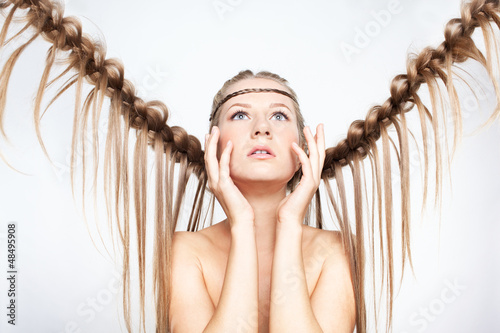 Photo: Portrait of young woman with braid hairdo Portrait of young woman with braid hairdo