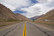 Lonely road surrounded by mountains