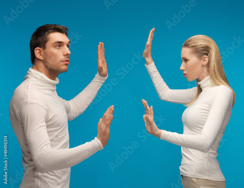 Photo: man and woman working with something imaginary man and woman working with something imaginary