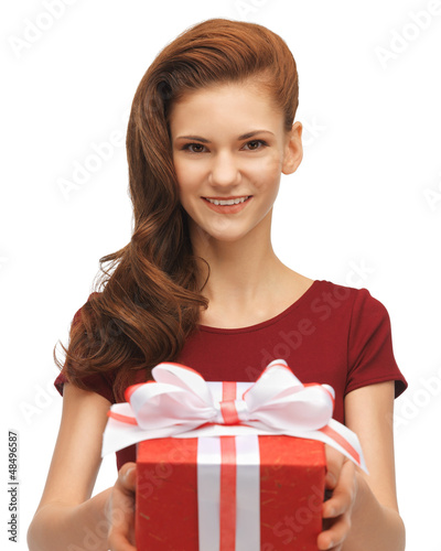 Photo: teenage girl in red dress with gift box teenage girl in red dress with gift box