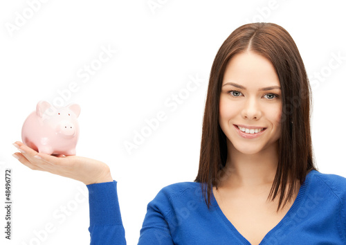 Photo: lovely woman with piggy bank lovely woman with piggy bank