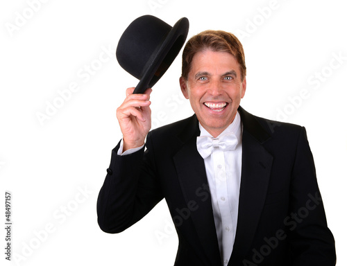 Photo: Man in tuxedo with hat celebrating Man in tuxedo with hat celebrating