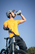 Mountain biker drinking water