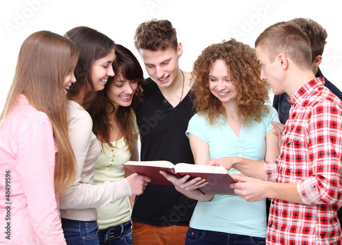 Photo: Group of students talking and holding notebooks Group of students talking and holding notebooks