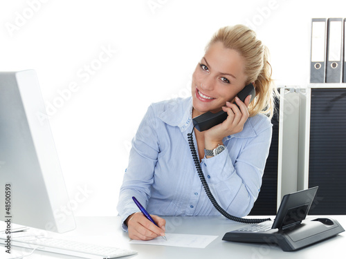 Photo: Pretty young woman has a good call in business Pretty young woman has a good call in business
