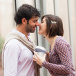 Romantic Young Couple with Gift for Her