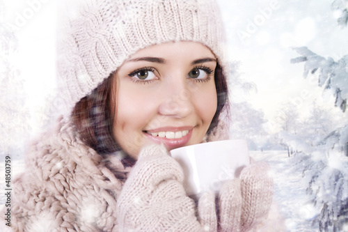 Photo: Winter girl drinking warm beverage. Winter girl drinking warm beverage.
