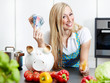 Woman in kitchen saves ready cash with cooking by herself