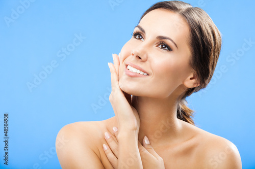 Photo: Portrait of beautiful woman, on blue Portrait of beautiful woman, on blue