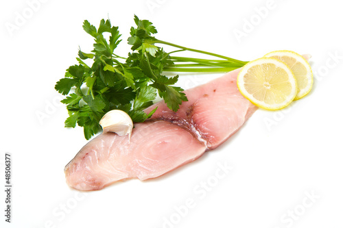 Photo: swordfish with lemon and parsley on white swordfish with lemon and parsley on white