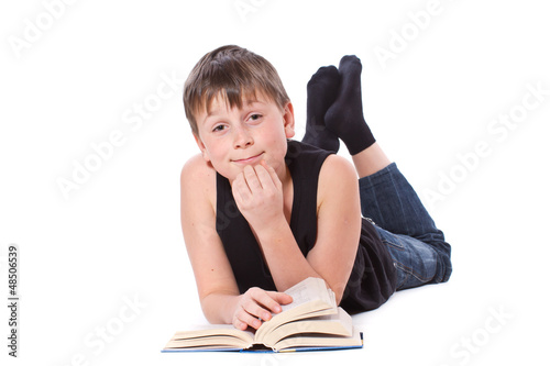 Photo: boy reading a book on white background boy reading a book on white background