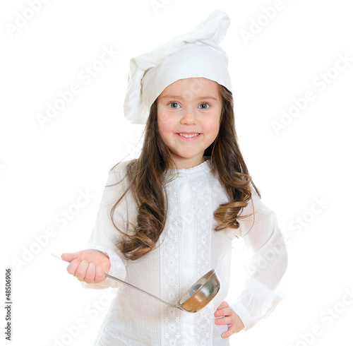 Photo: Pretty little girl in chef's hat holding ladle. Pretty little girl in chef's hat holding ladle.