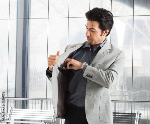 Photo: Man taking his wallet Man taking his wallet