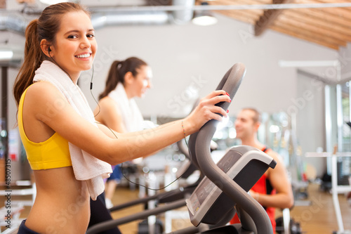 Photo: Woman training in a gym Woman training in a gym