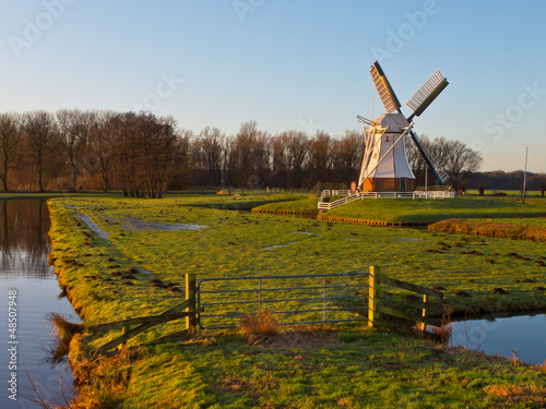 Photo: White windmill against blue sky White windmill against blue sky