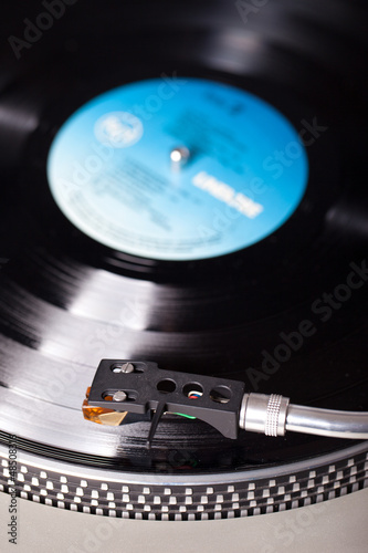 Photo: Vintage record player with vinyl record Vintage record player with vinyl record