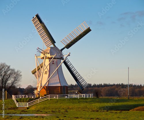 Photo: White windmill against blue sky White windmill against blue sky
