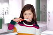Photo: Pretty little girl brushing teeth Pretty little girl brushing teeth