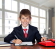Photo: Little businessman in the office Little businessman in the office