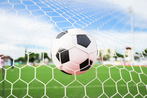 Photo: soccer ball in goal net soccer ball in goal net