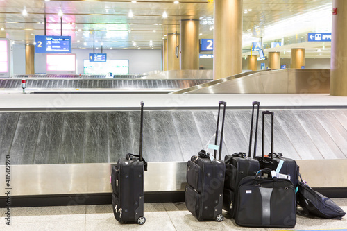 Photo: Suitcases and luggage band on the airport Suitcases and luggage band on the airport