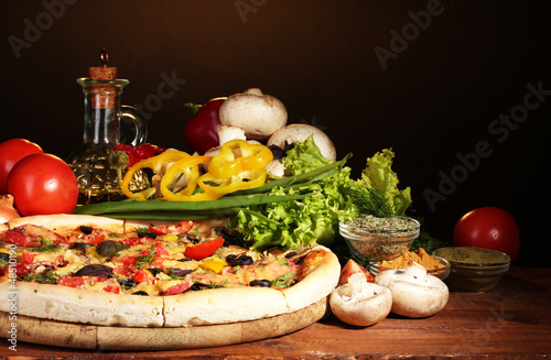 Photo: delicious pizza, vegetables and spices delicious pizza, vegetables and spices
