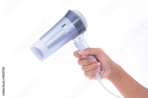 Photo: hand holding hair dryer isolated on white background hand holding hair dryer isolated on white background