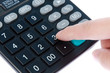 Photo: Calculator with finger isolated on white Calculator with finger isolated on white