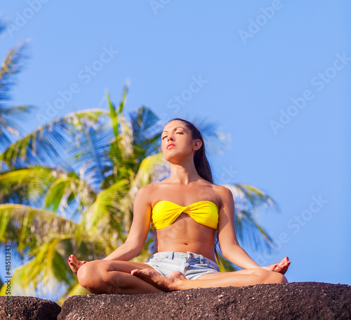 Photo: woman practicing yoga woman practicing yoga