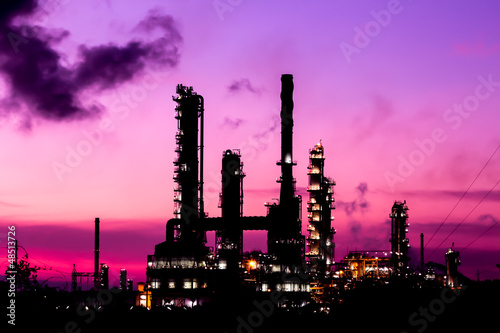 Photo: silhouette oil refinery plant and smoke at twilight morning silhouette oil refinery plant and smoke at twilight morning
