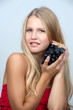 Young girl holding a bunch of grapes