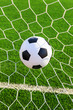 soccer ball in goal net