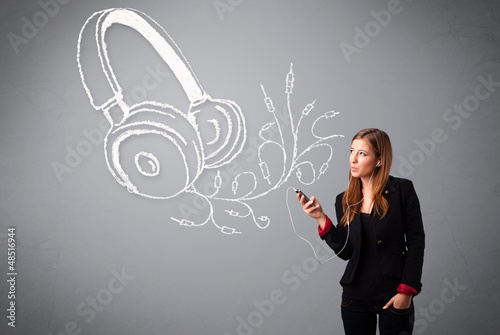 Photo: young woman singing and listening to music with abstract headpho young woman singing and listening to music with abstract headpho