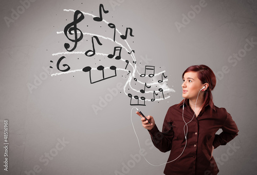 Photo: attractive young lady singing and listening to music with musica attractive young lady singing and listening to music with musica