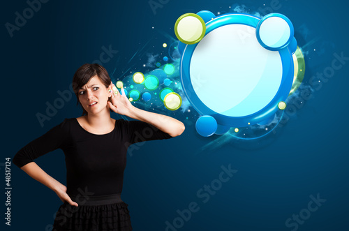 Photo: Young woman with abstract modern speech bubble Young woman with abstract modern speech bubble