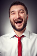 joyful man over dark background