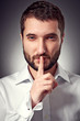 serious man showing silent sign
