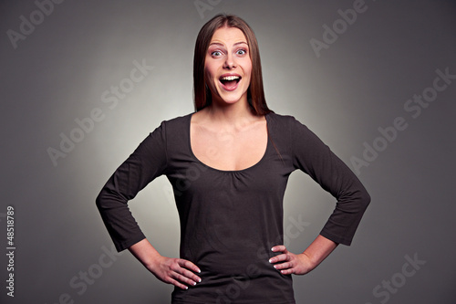 Photo: studio portrait of excited woman studio portrait of excited woman