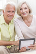 Senior Man & Woman Couple Using Tablet Computer