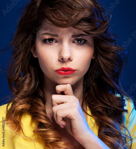 Photo: Expressive portrait of a beautiful young woman Expressive portrait of a beautiful young woman