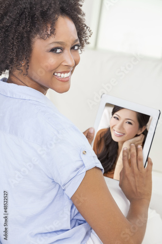 Photo: African American Woman Using Tablet Computer African American Woman Using Tablet Computer