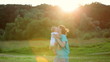Happy mother playing with baby outdoor