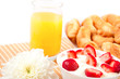Breakfast: croissants, strawberries with cream, orange juice